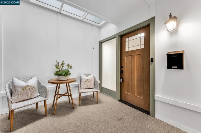 a view of a living room kitchen and a wooden floor