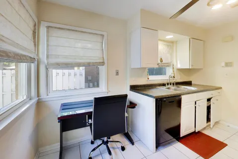 a kitchen with a stove a sink and a refrigerator
