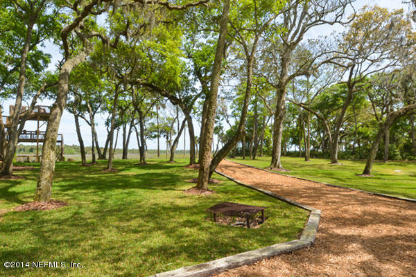 1126 Neck Road Ponte Vedra Beach, FL 32082 - Photo 12 of 32 a big yard with lots of trees