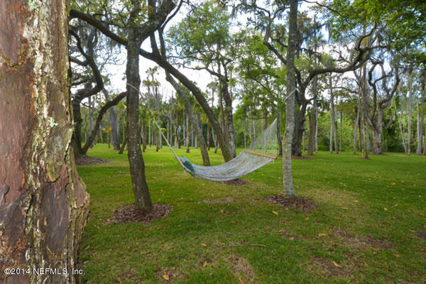 1126 Neck Road Ponte Vedra Beach, FL 32082 - Photo 15 of 32 a view of a garden with a tree