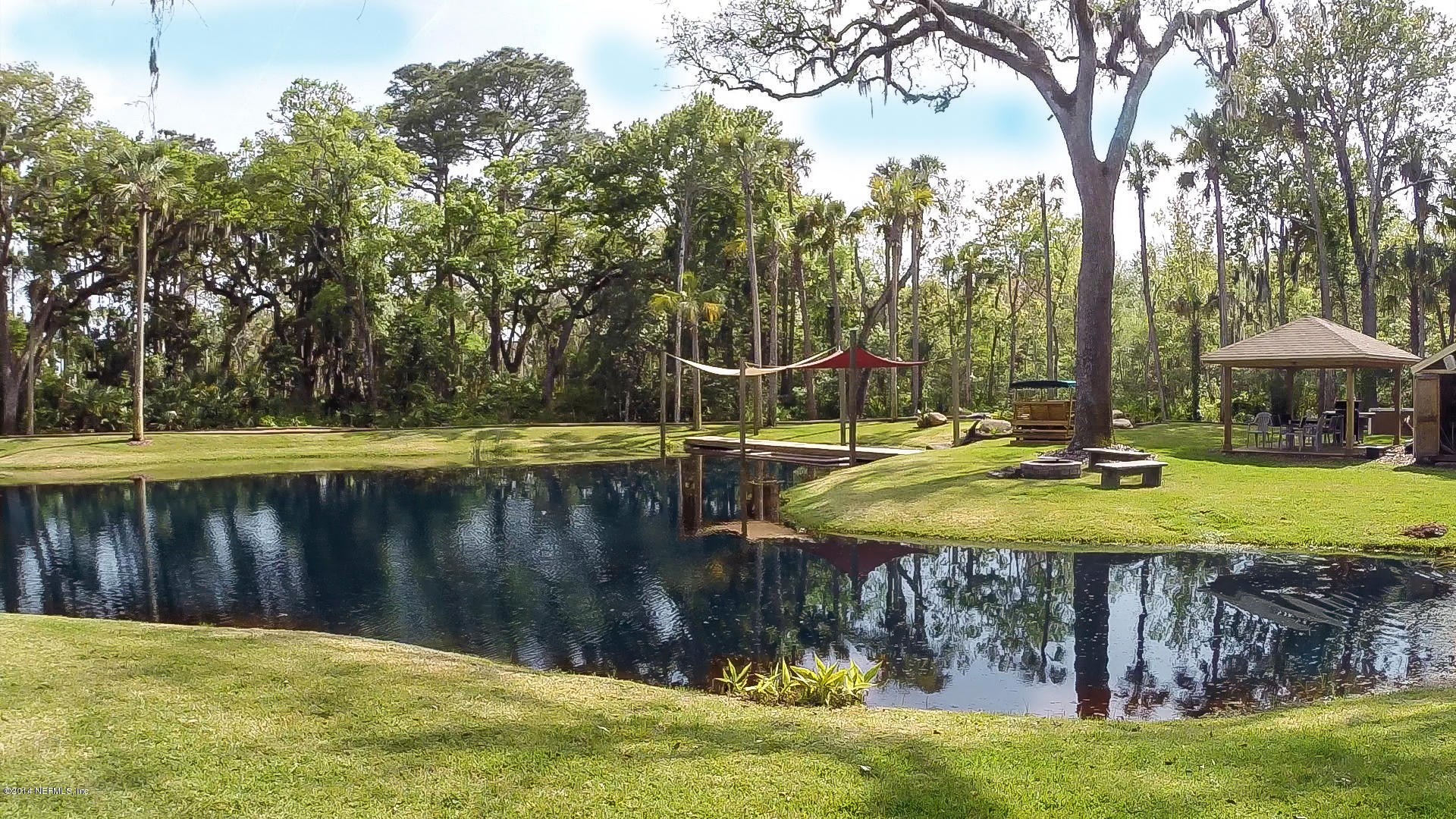1126 Neck Road Ponte Vedra Beach, FL 32082 - Photo 5 of 32 a view of a swimming pool with a patio and a yard