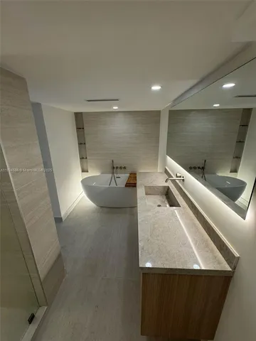 a kitchen with a refrigerator and a stove