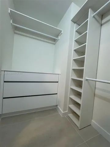 a view of an empty walk in closet