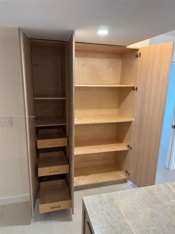 a view of an empty walk in closet