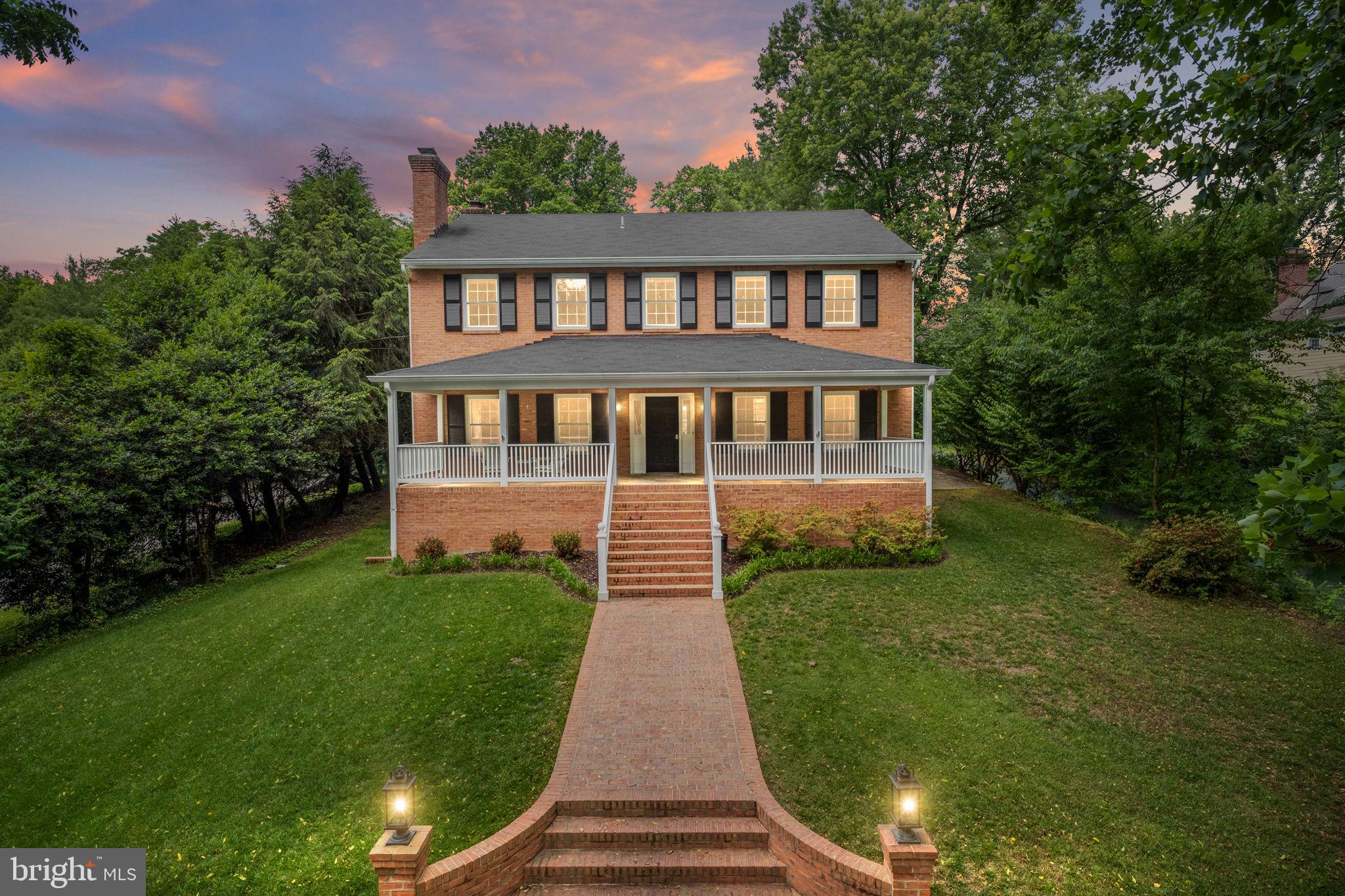 6916 Seven Locks Road Cabin John, MD 20818 - Photo 11 of 38 a view of a house with a yard