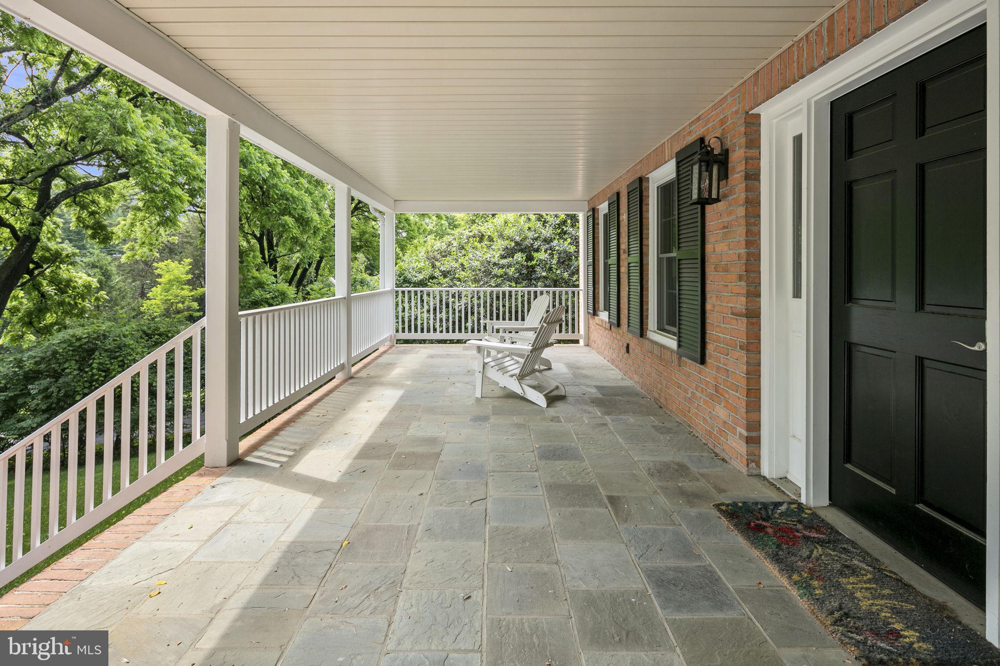 6916 Seven Locks Road Cabin John, MD 20818 - Photo 12 of 38 a view of a porch with wooden floor and outdoor space