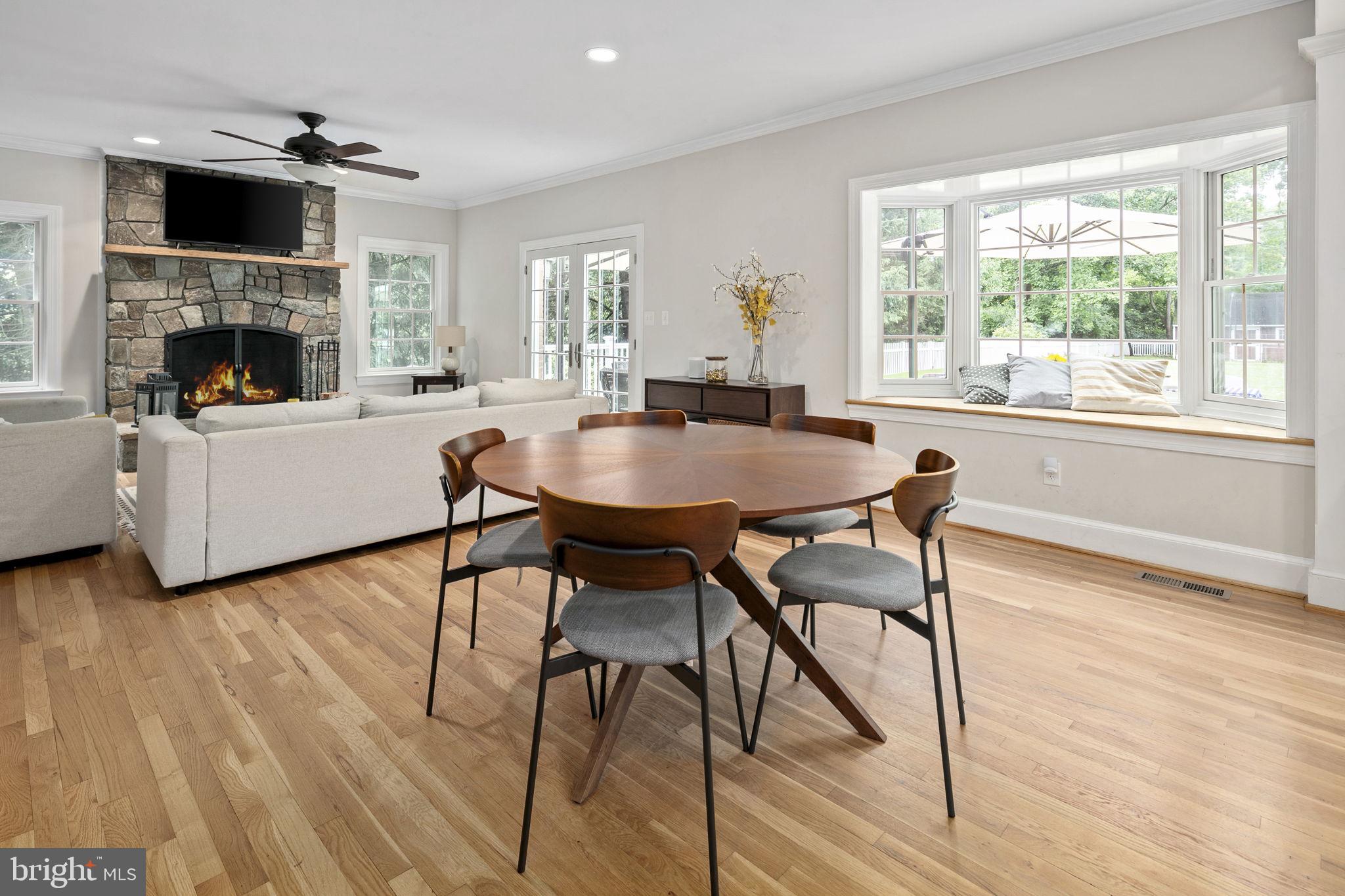 6916 Seven Locks Road Cabin John, MD 20818 - Photo 13 of 38 a living room with furniture and a fireplace