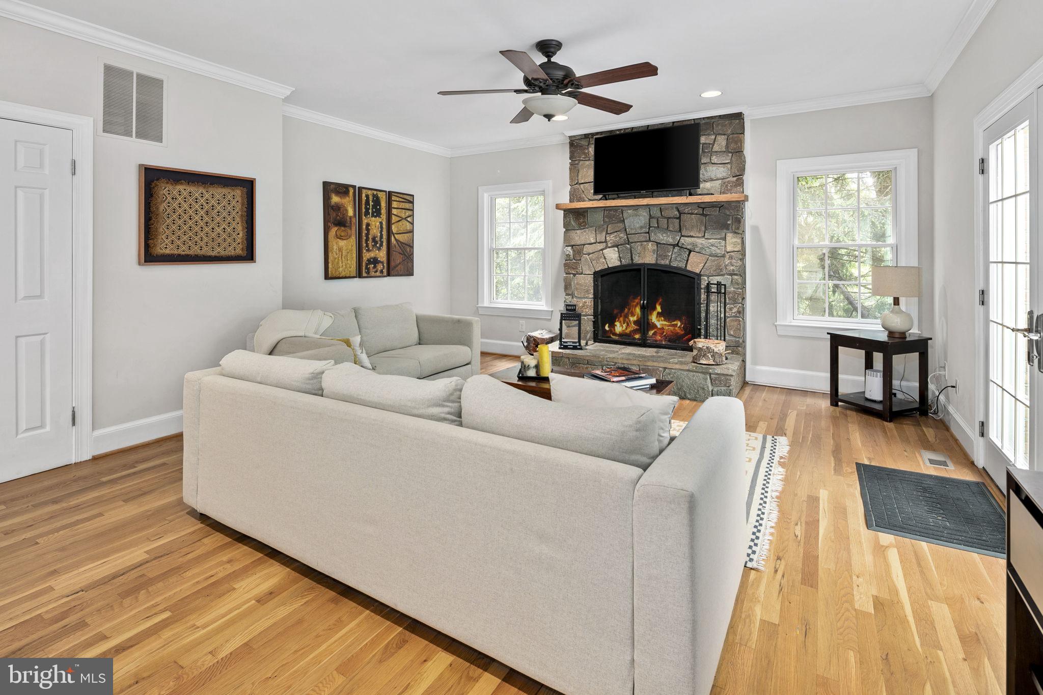 6916 Seven Locks Road Cabin John, MD 20818 - Photo 15 of 38 a living room with furniture and a fireplace