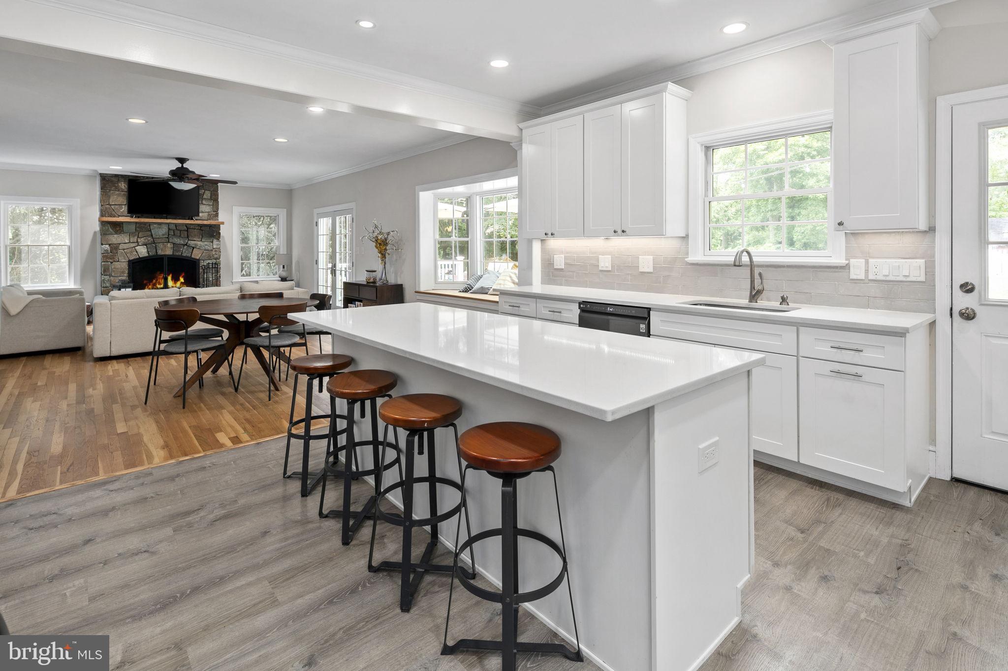 6916 Seven Locks Road Cabin John, MD 20818 - Photo 22 of 38 a large kitchen with lots of counter space a sink and appliances