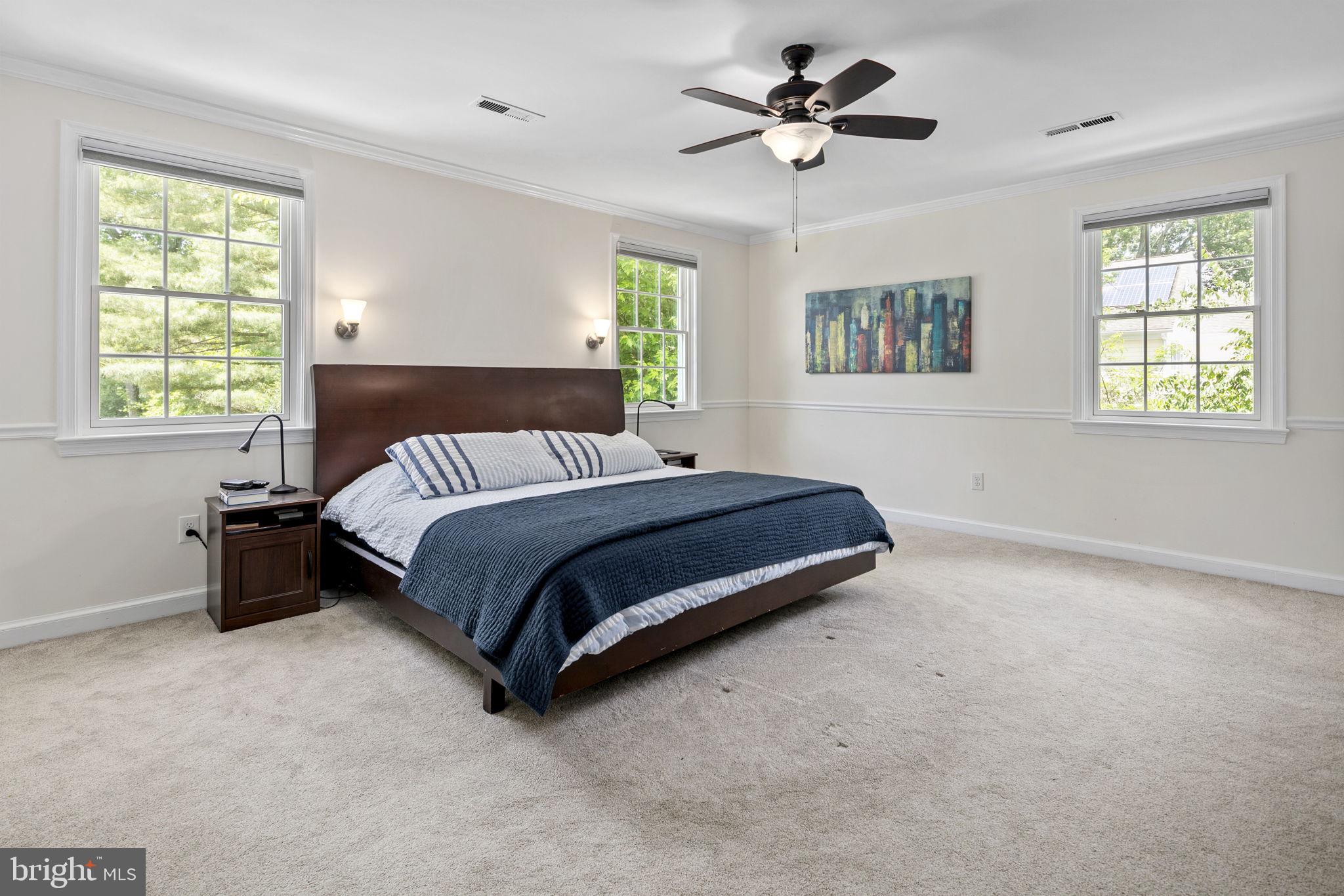 6916 Seven Locks Road Cabin John, MD 20818 - Photo 23 of 38 a bedroom with a bed dresser and a window