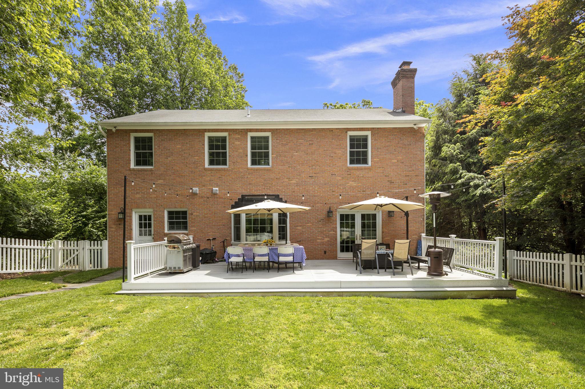 6916 Seven Locks Road Cabin John, MD 20818 - Photo 26 of 38 a view of a house with swimming pool and porch