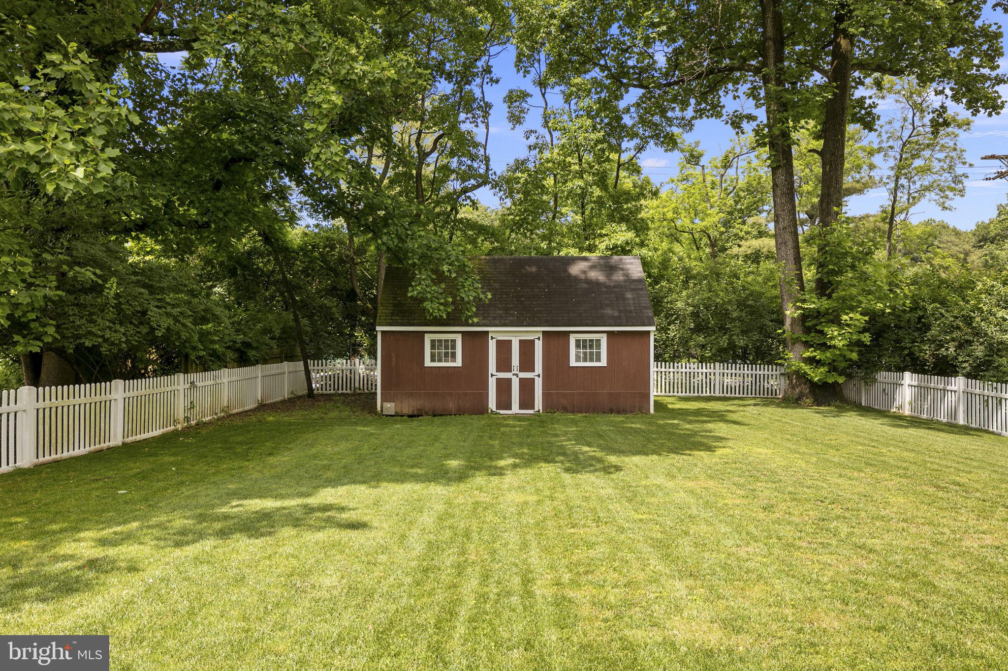 6916 Seven Locks Road Cabin John, MD 20818 - Photo 31 of 38 a view of a house with a yard