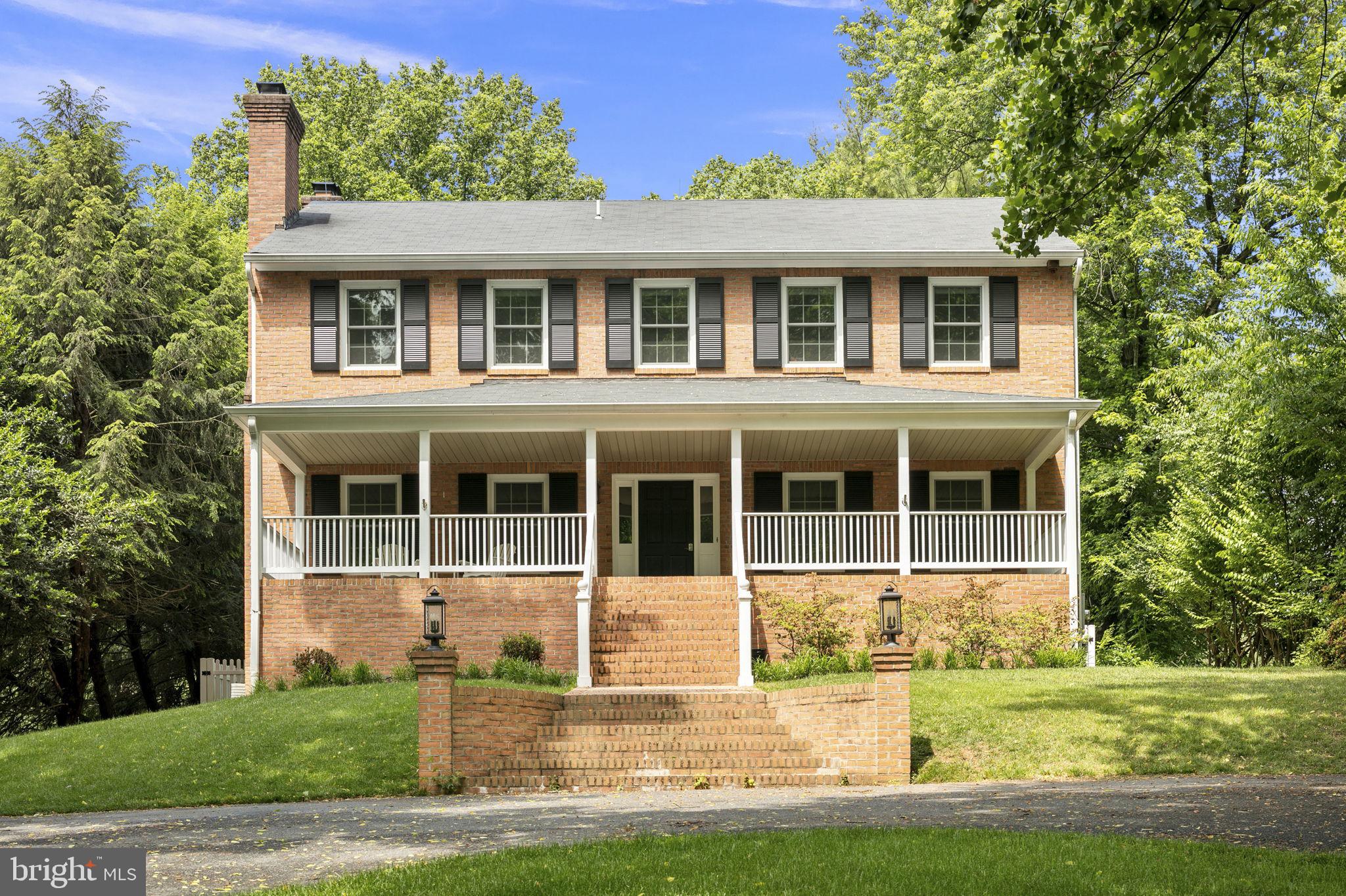 6916 Seven Locks Road Cabin John, MD 20818 - Photo 38 of 38 a front view of a house with a yard