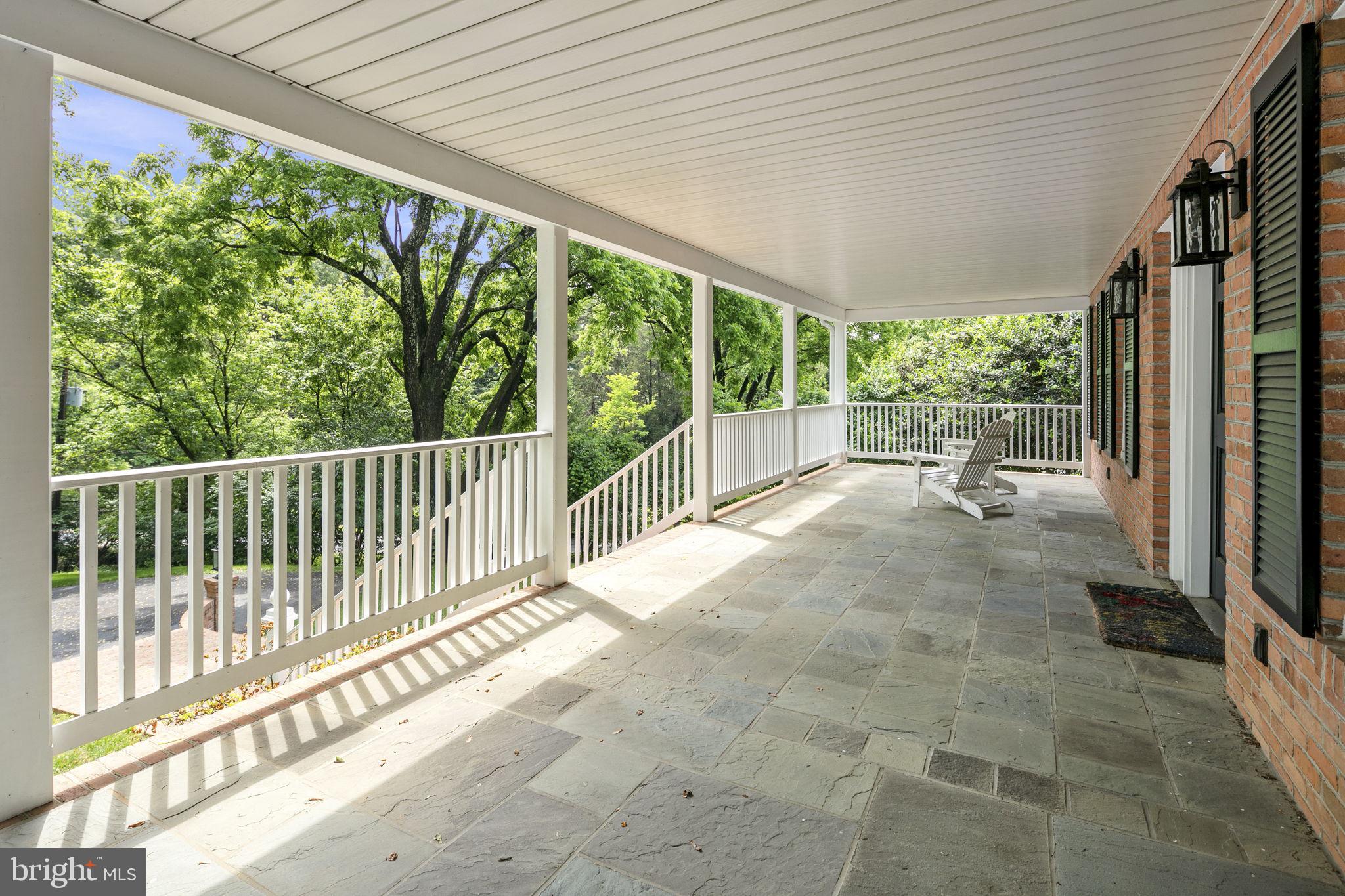 6916 Seven Locks Road Cabin John, MD 20818 - Photo 5 of 38 a view of a porch with wooden floor and outdoor space