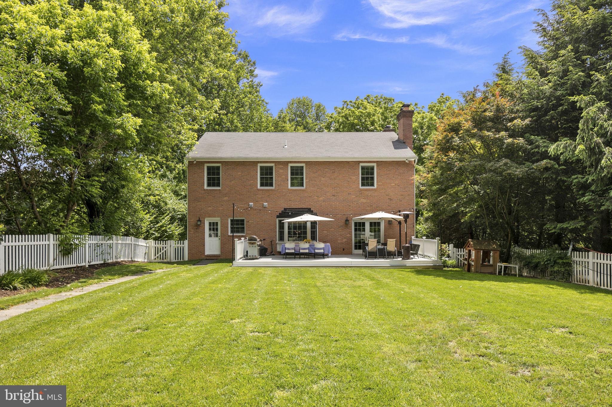 6916 Seven Locks Road Cabin John, MD 20818 - Photo 7 of 38 a view of a house with a yard porch and sitting area