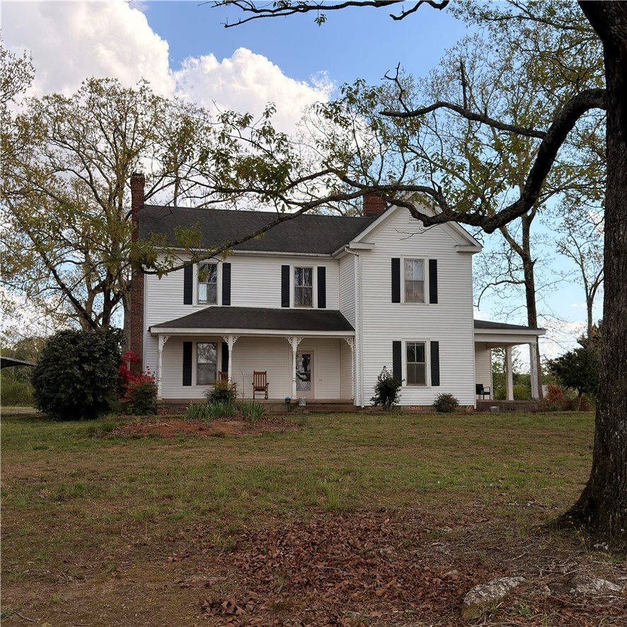 1014 Levis Smith Road Pendleton, SC 29670 - Photo 2 of 21 This classic white farmhouse offers a charming porch and a spacious yard, ideal for tranquil living.