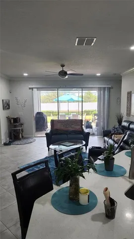 a kitchen with a table chairs and a wooden floor