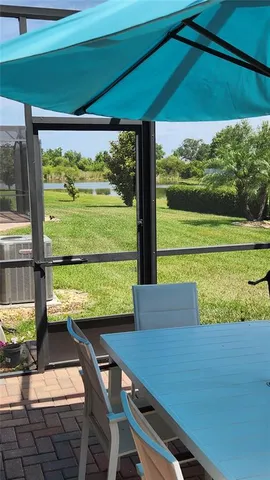 a view of a city from a dining room with furniture