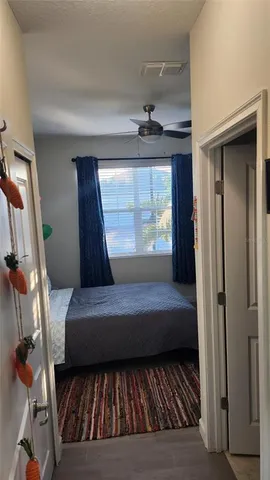 a living room with a bed furniture and a window