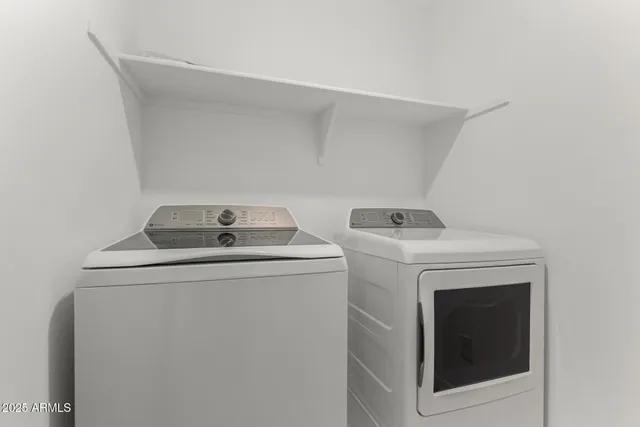 a view of backyard with barbeque grill and wooden fence