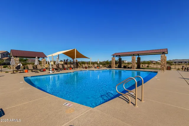 a view of swimming pool with a yard