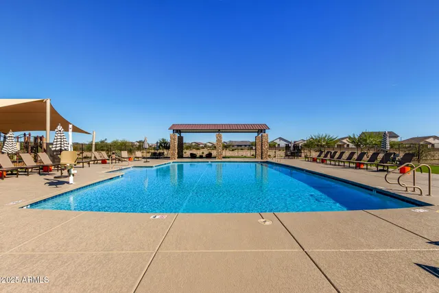 a view of a house with a yard and porch