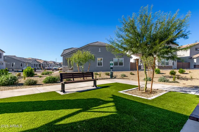 a view of a backyard with wooden floor