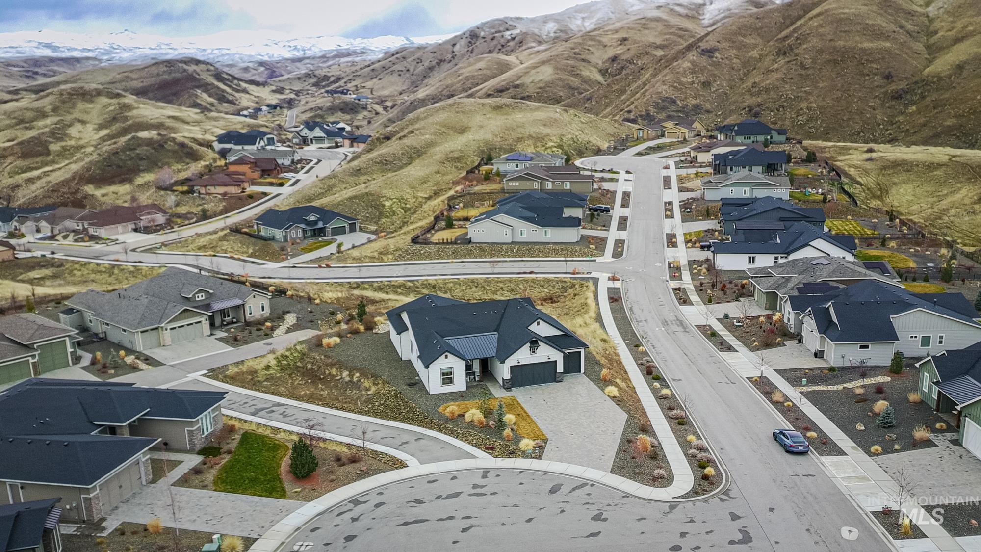 18357 North Burnt Car Way Boise, ID 83714 - Photo 47 of 48 Aerial view of property and surrounding area with nearby suburban area and mountains