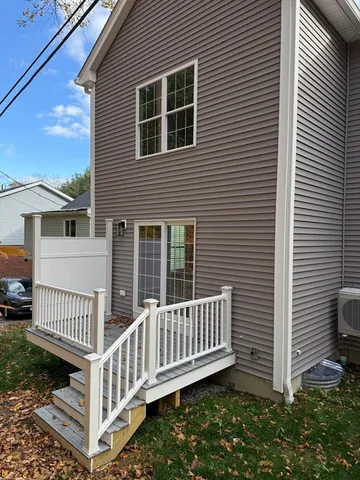 a view of a house with wooden fence