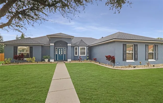 a front view of a house with garden