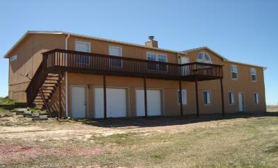 13555 Evans Road Elbert, CO 80106 - Photo 1 of 1 a front view of a house with a yard