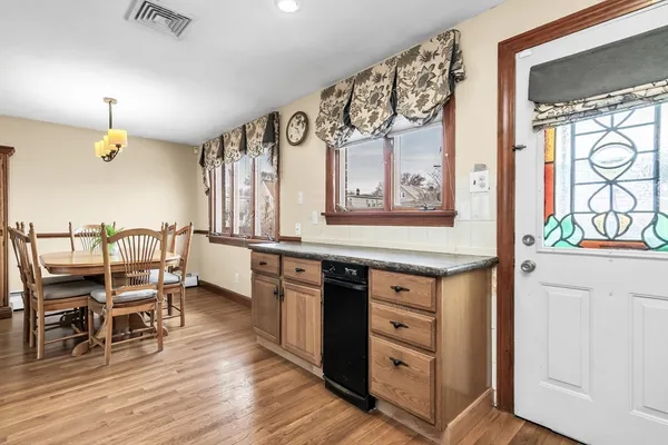 a kitchen with stainless steel appliances granite countertop a stove and cabinets