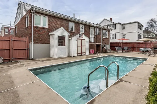 a front view of a house with swimming pool