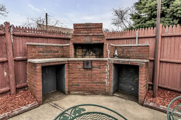 an aerial view of a house with a swimming pool and outdoor seating