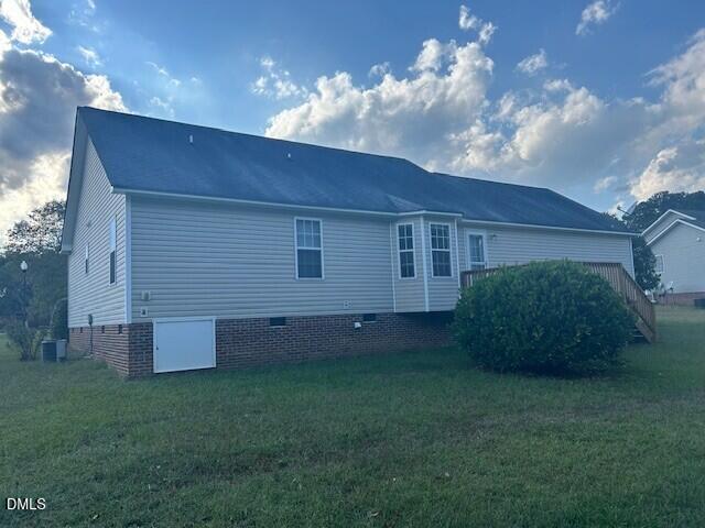 85 Opal Lane Clayton, NC 27520 - Photo 13 of 15 a view of a backyard with potted plants and large trees