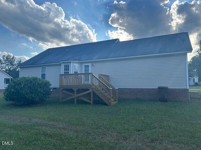 85 Opal Lane Clayton, NC 27520 - Photo 14 of 15 a view of a backyard with plants and a garden