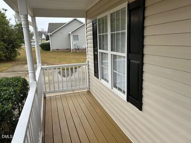 a view of deck with wooden floor and fence