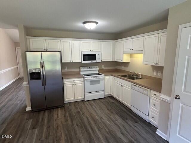 85 Opal Lane Clayton, NC 27520 - Photo 6 of 15 a kitchen with white cabinets and stainless steel appliances