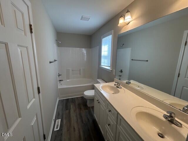 85 Opal Lane Clayton, NC 27520 - Photo 8 of 15 a bathroom with a sink a toilet a tub and shower