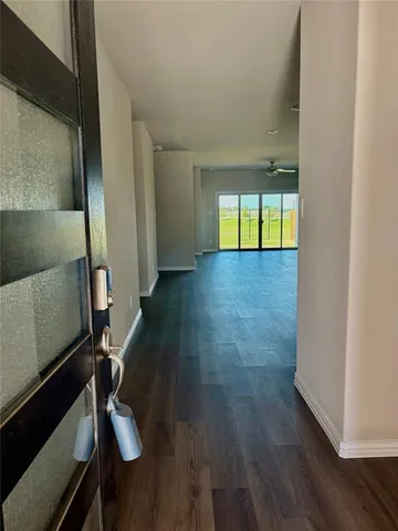 a view of entryway with wooden floor