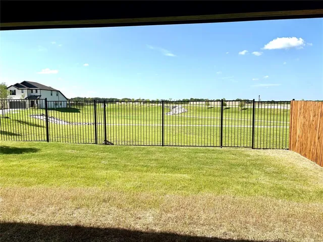 a view of a lake and a yard