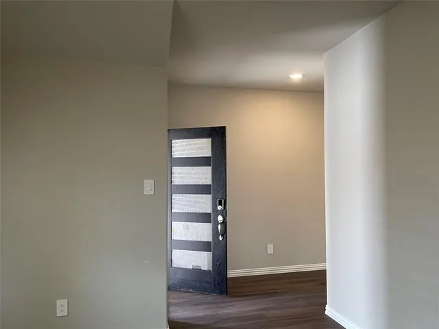 a view of entryway with wooden floor