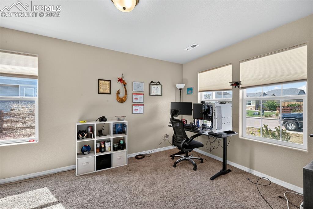 10859 Hidden Ridge Circle Peyton, CO 80831 - Photo 18 of 33 Office area featuring light colored carpet and baseboards