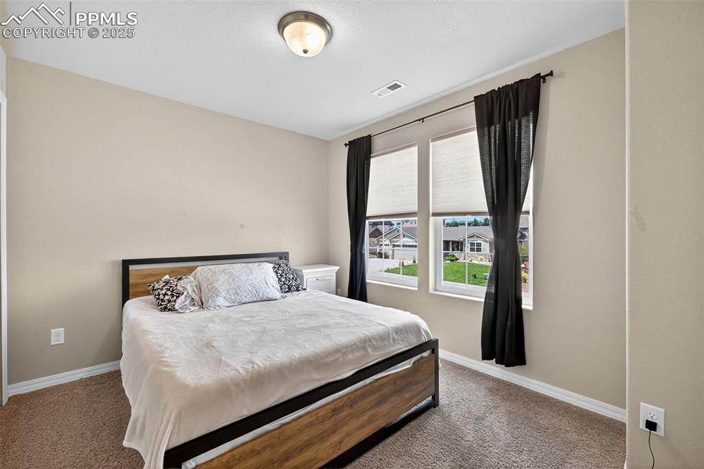 10859 Hidden Ridge Circle Peyton, CO 80831 - Photo 28 of 33 Carpeted bedroom with baseboards