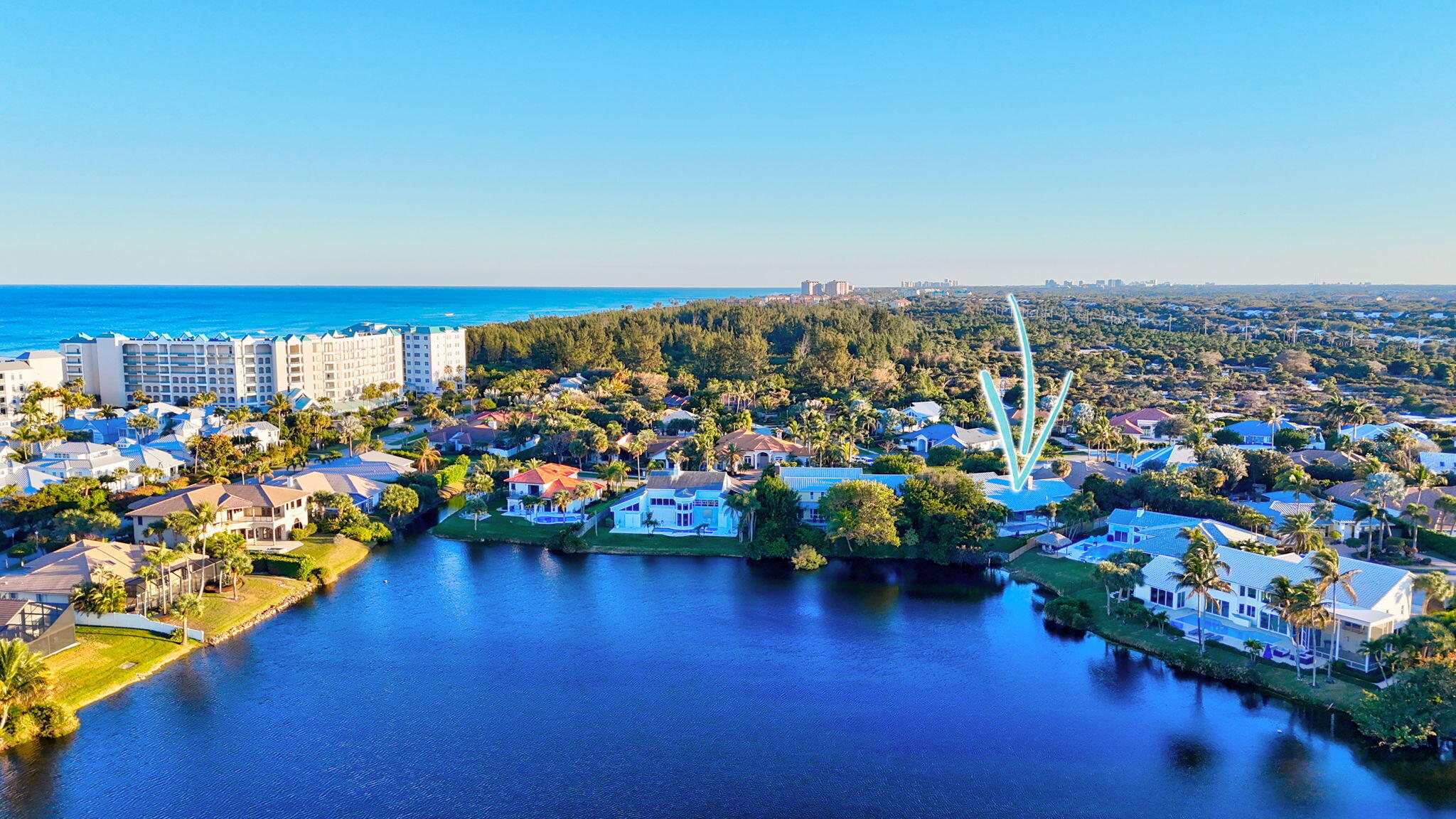 123 Olympus Way Jupiter, FL 33477 - Photo 109 of 116 an aerial view of a houses with a lake view