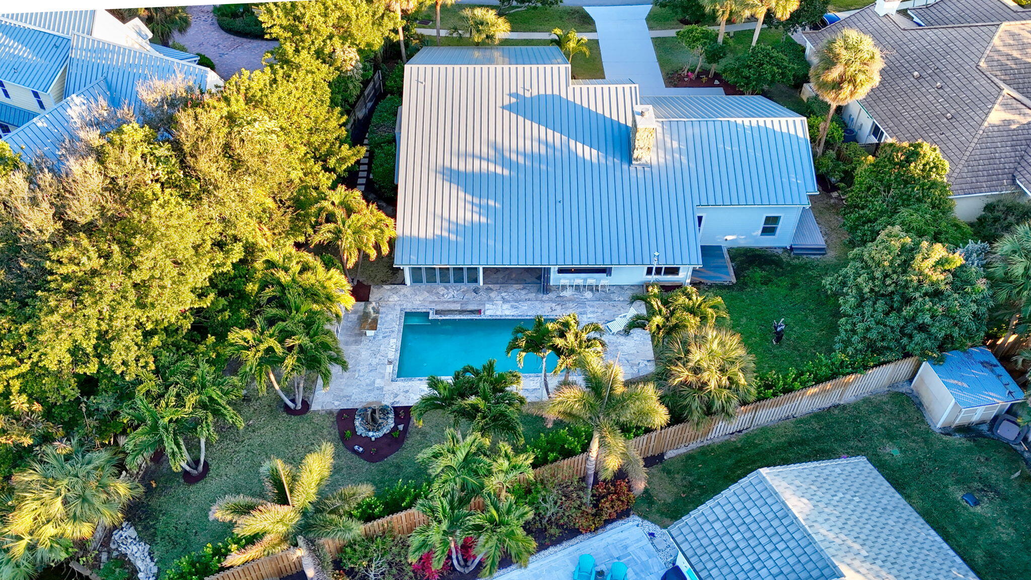 123 Olympus Way Jupiter, FL 33477 - Photo 114 of 116 an aerial view of a house with a yard and garden