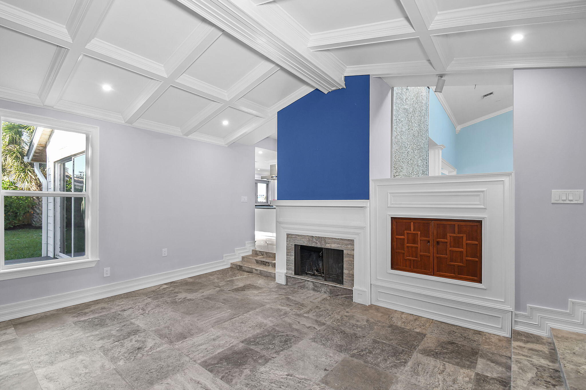 123 Olympus Way Jupiter, FL 33477 - Photo 15 of 116 a view of an empty room with a fireplace and a window