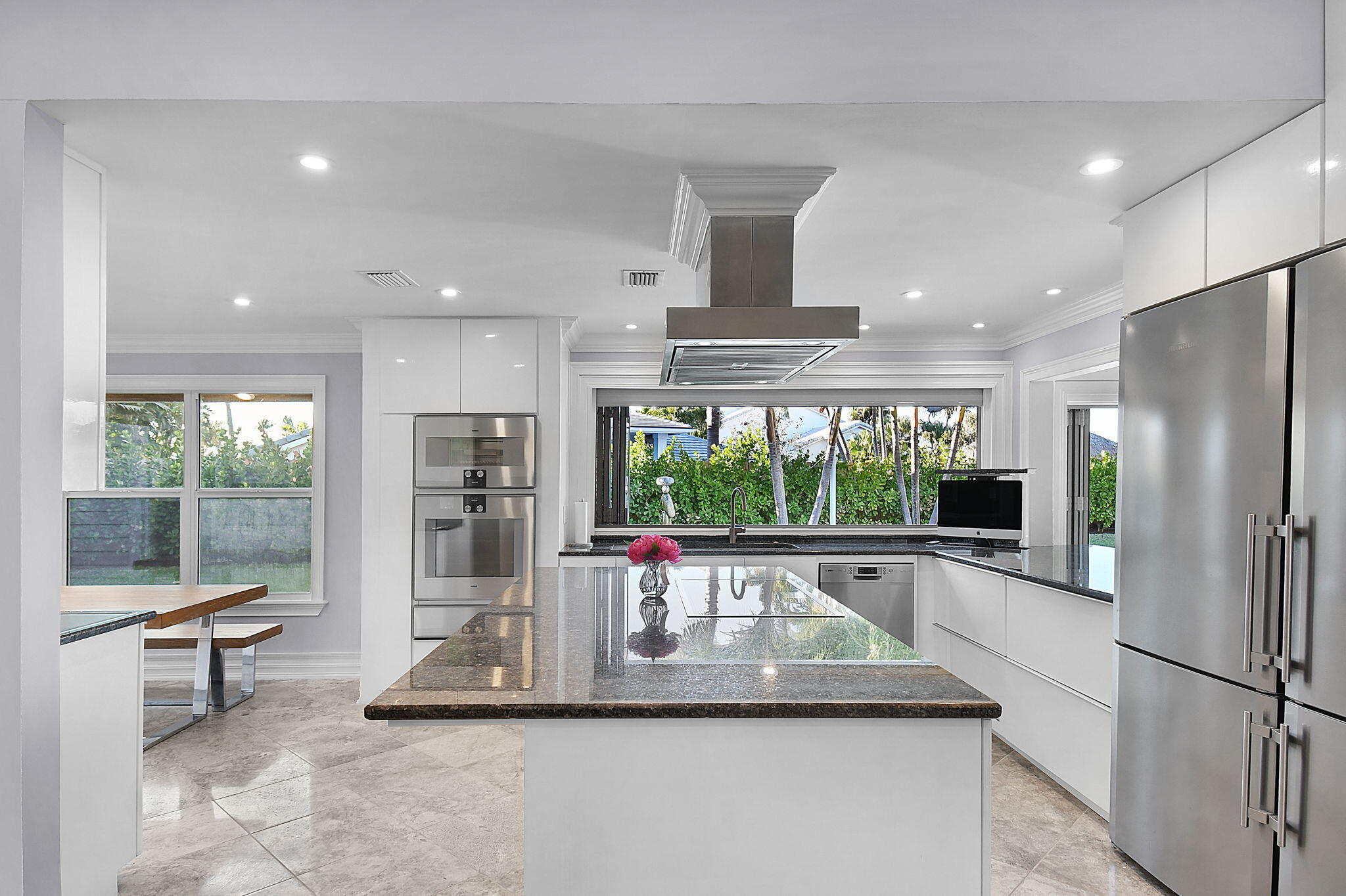 123 Olympus Way Jupiter, FL 33477 - Photo 34 of 116 a kitchen with stainless steel appliances granite countertop a refrigerator and a view of living room