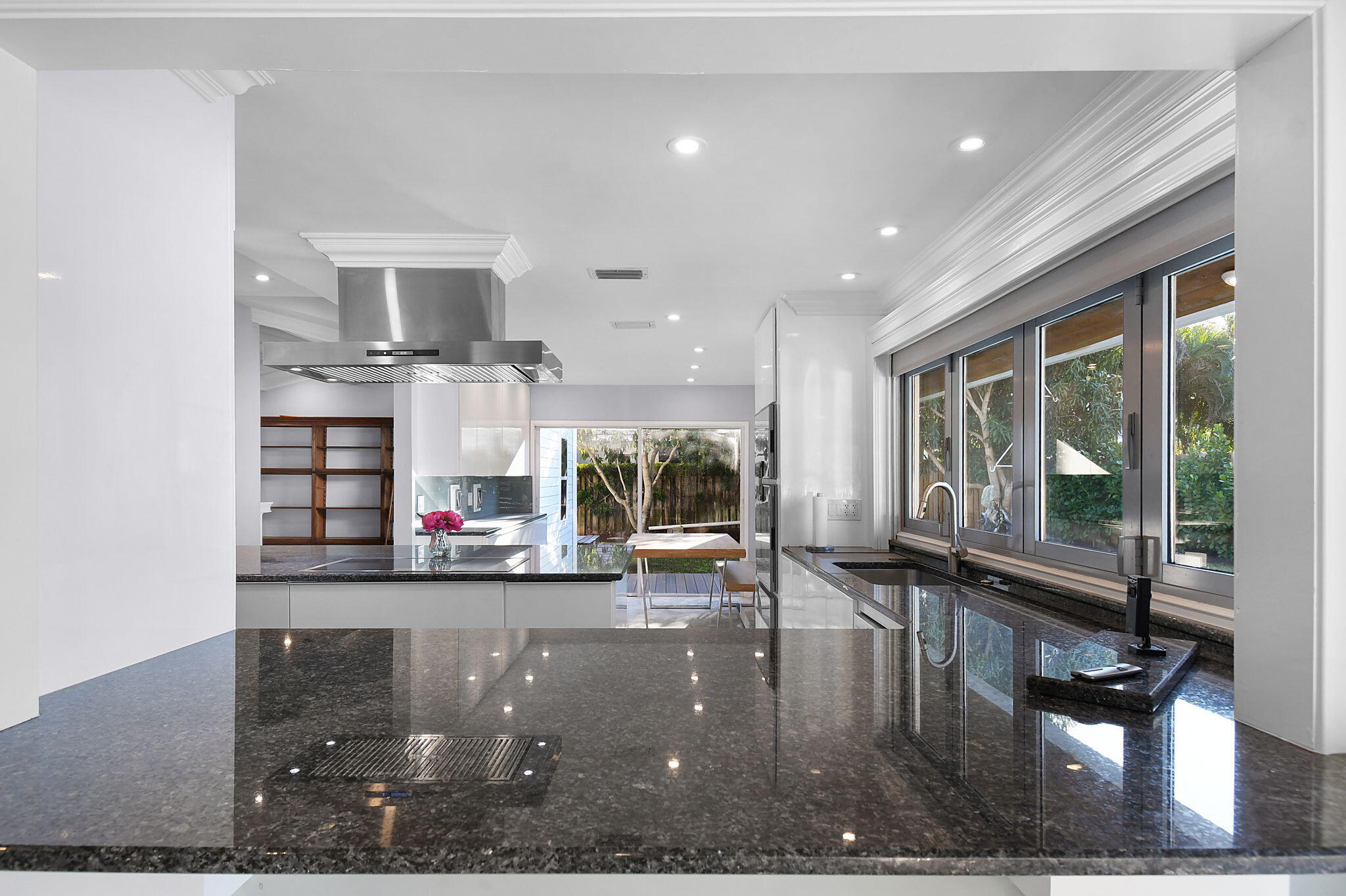 123 Olympus Way Jupiter, FL 33477 - Photo 37 of 116 a living room with fireplace furniture and a floor to ceiling window