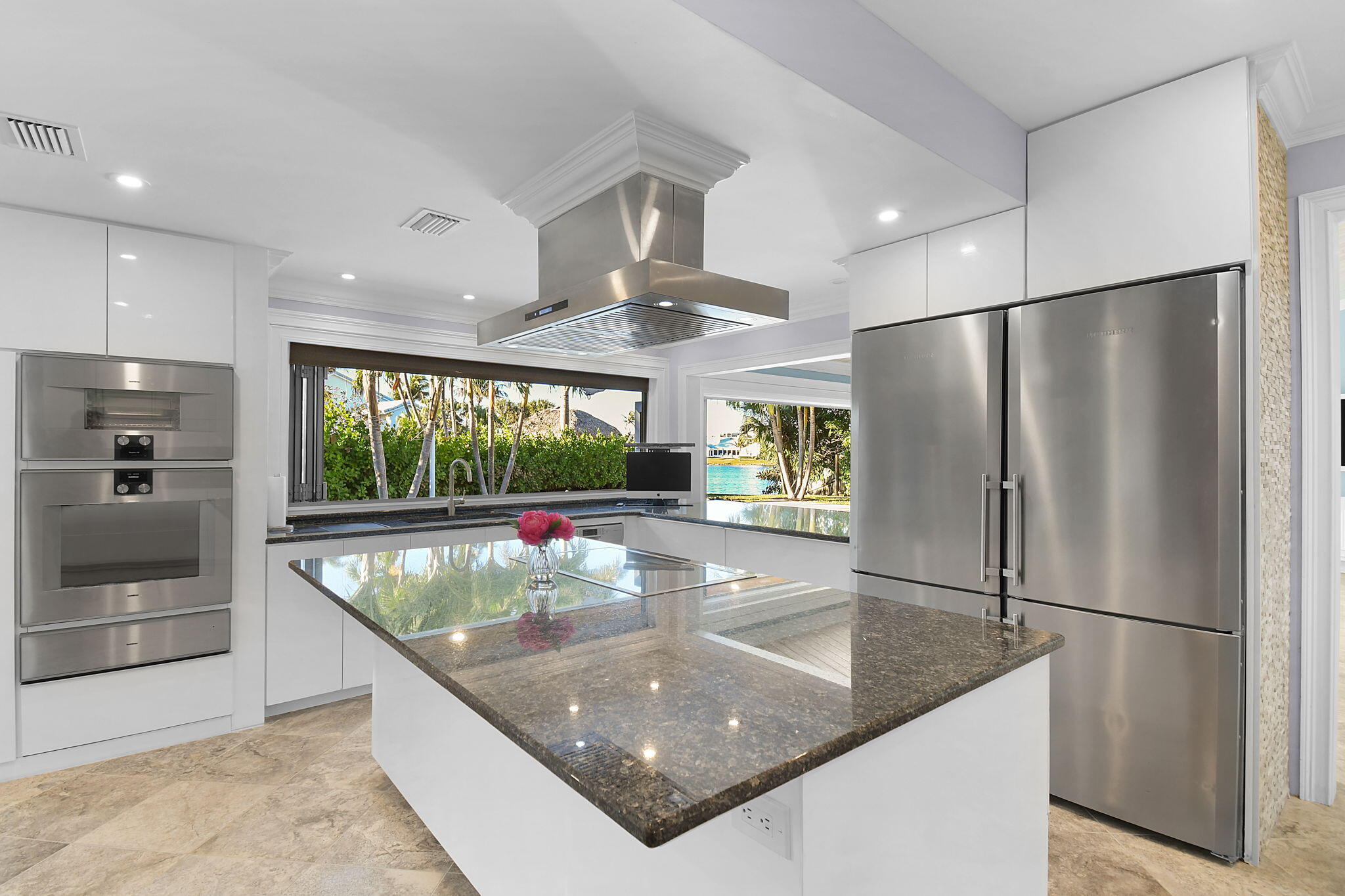123 Olympus Way Jupiter, FL 33477 - Photo 38 of 116 a kitchen with stainless steel appliances granite countertop a refrigerator and a sink